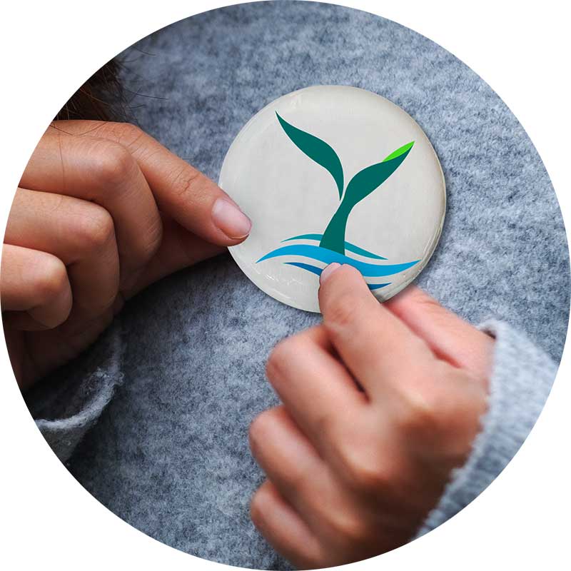 Hands holding button with RIEEA logo