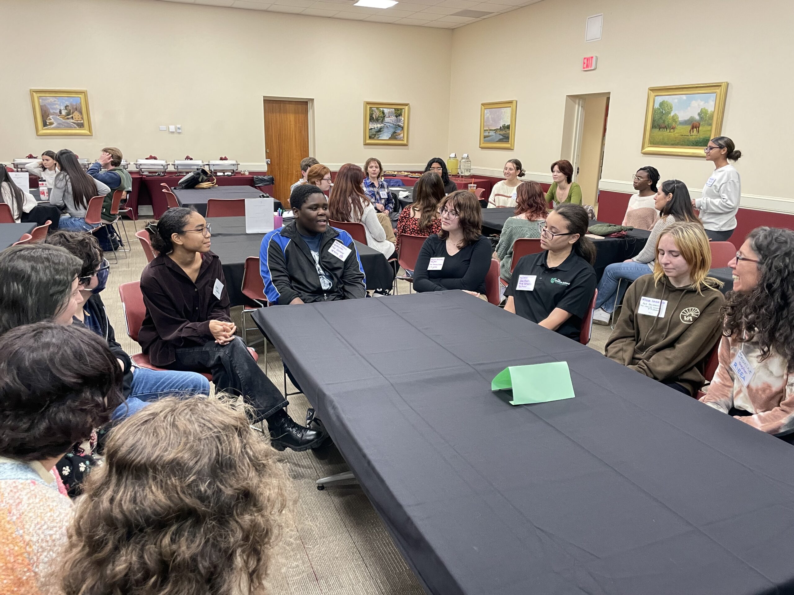 Youth retreat - young people of diverse races at table