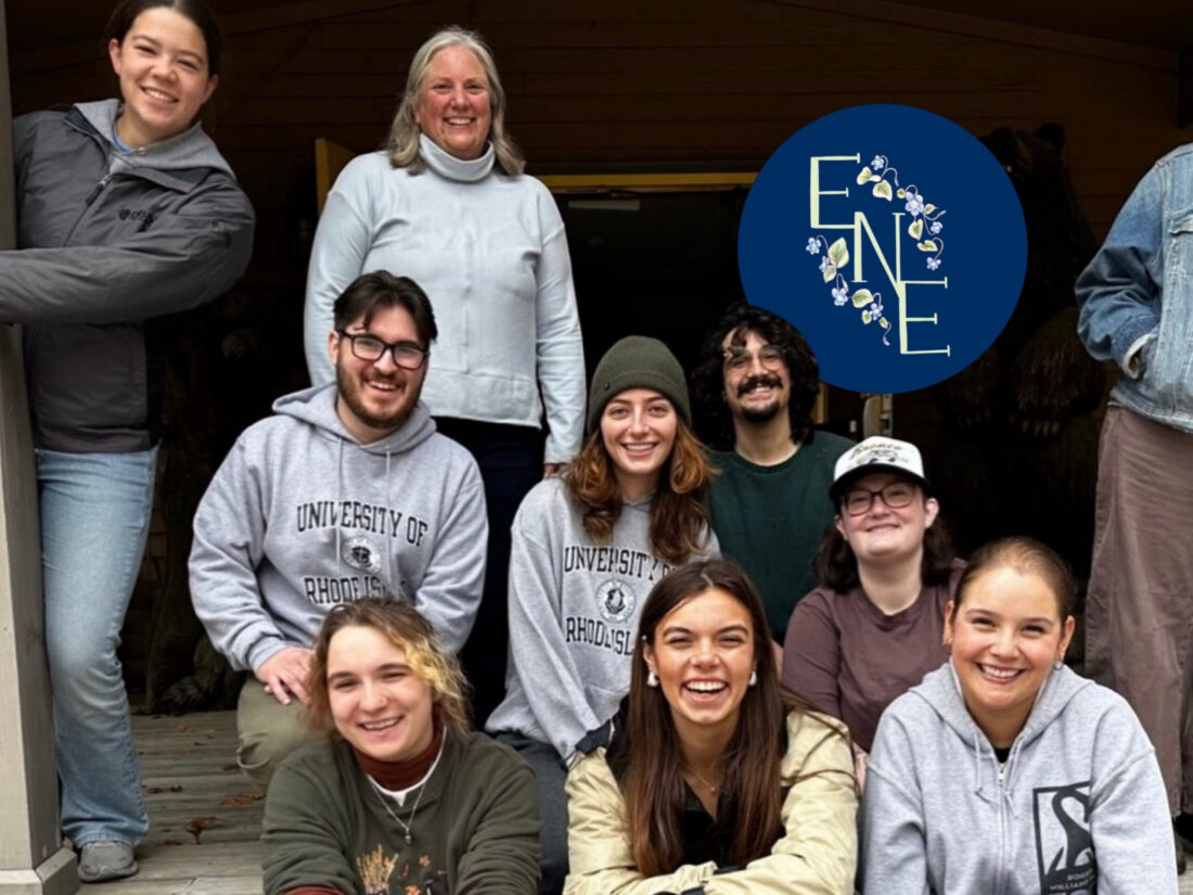 group of future environmental educators (with their professor) smiling